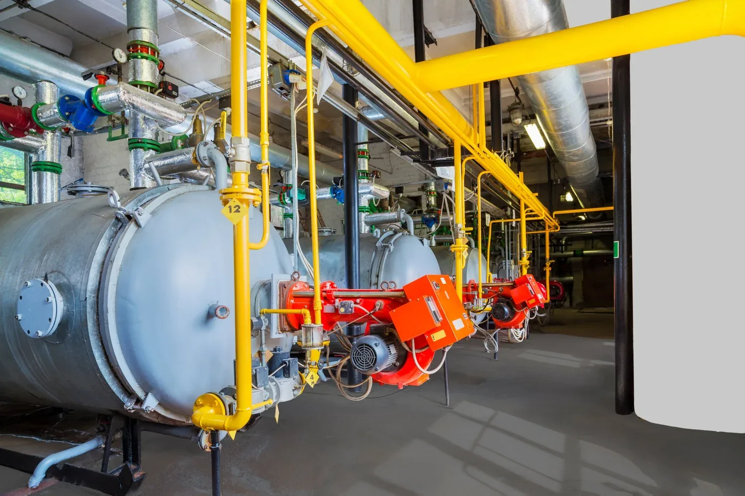 Fabrication shop floor where Flare Services builds combustion equipment