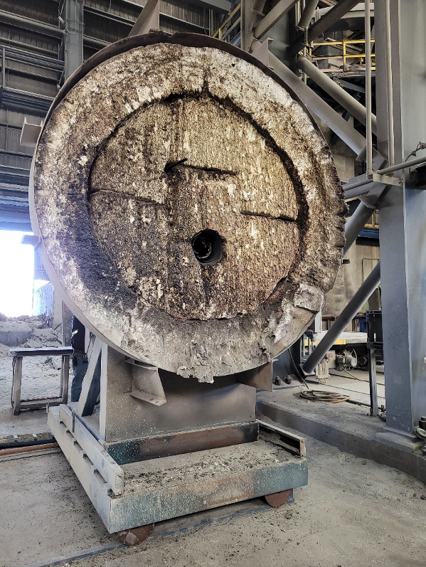 Worn refractory lining inside a large steel mill ladle or crucible